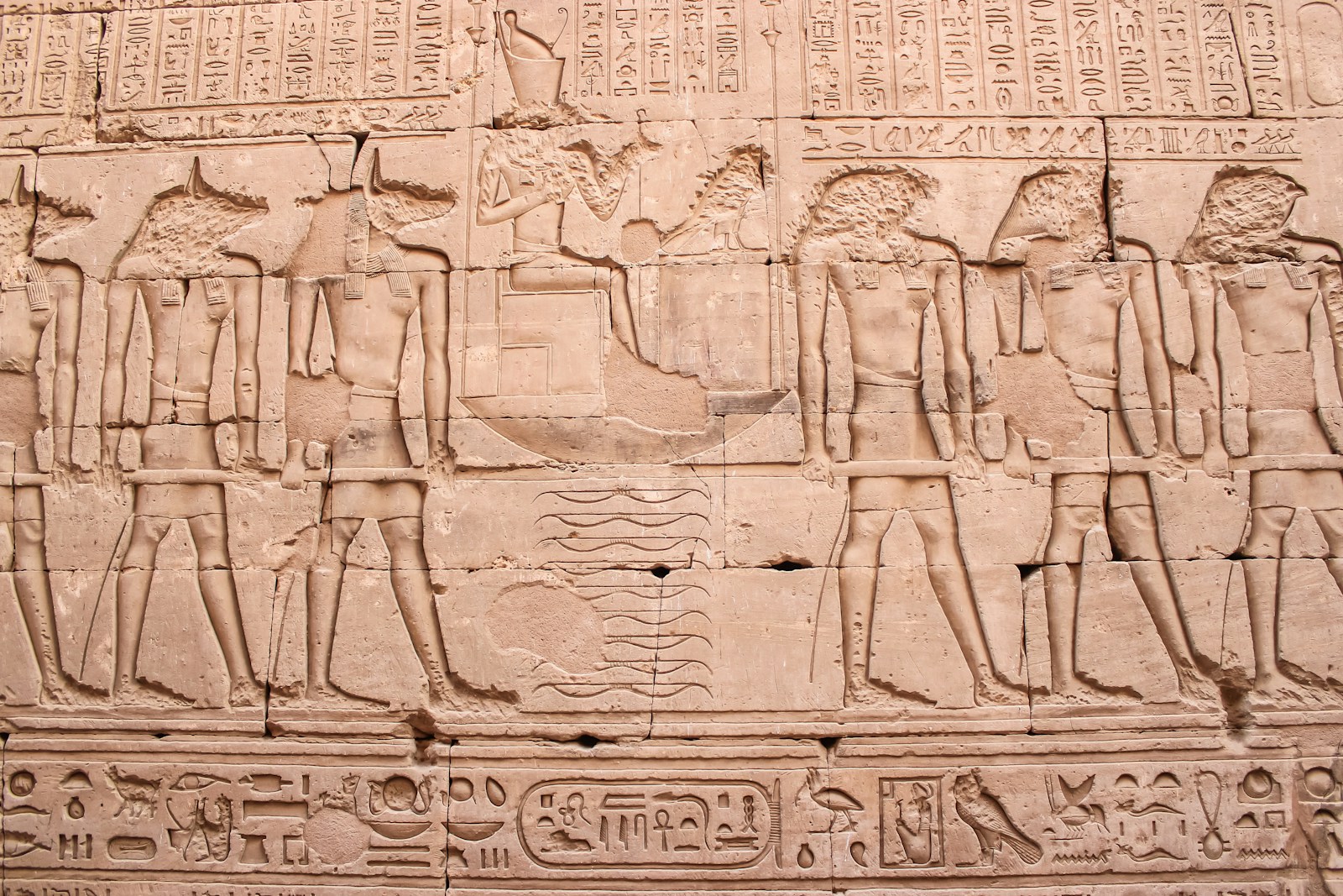 a wall with a bunch of ancient egyptian art on it